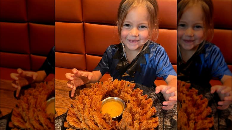 Outback Steakhouse girl eating