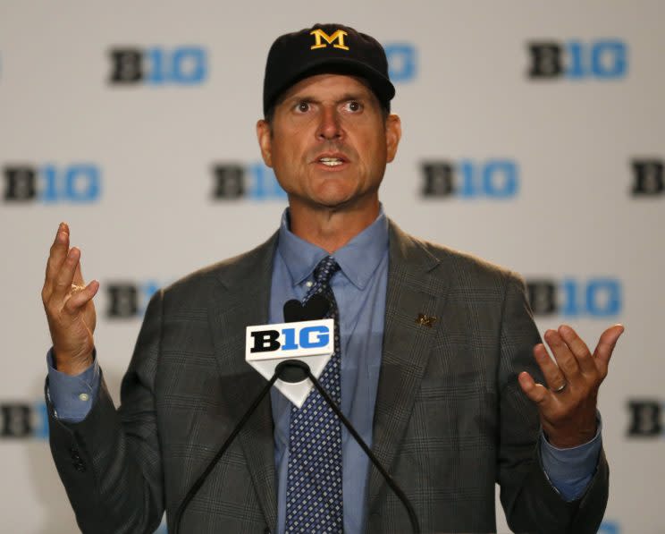 Michigan head coach Jim Harbaugh always brings the intrigue. (AP)