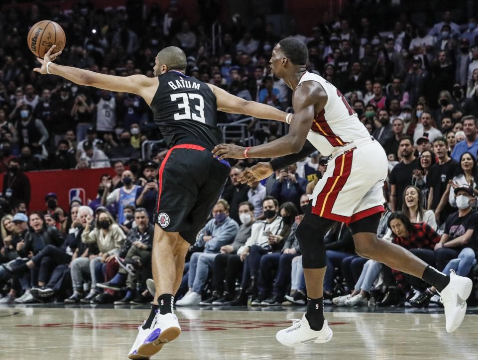 Clippers forward Nicolas Batum steals an inbounds pass intended for Heat center Bam Adebayo.