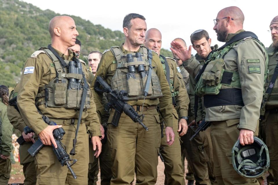 Israeli military Chief of General Staff Herzi Halevi stands with Israeli military soldiers, at a location given as northern Israel, in this picture released on Jan. 3, 2024.   