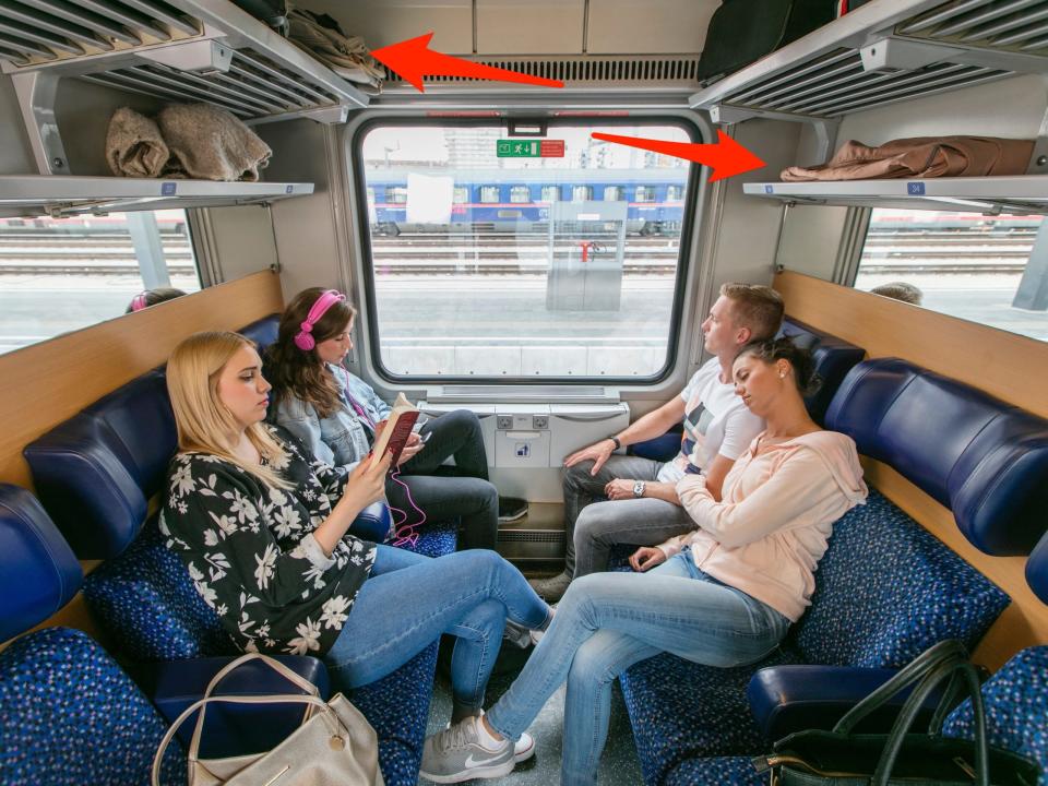 Arrows point to luggage space in a seating carriage.