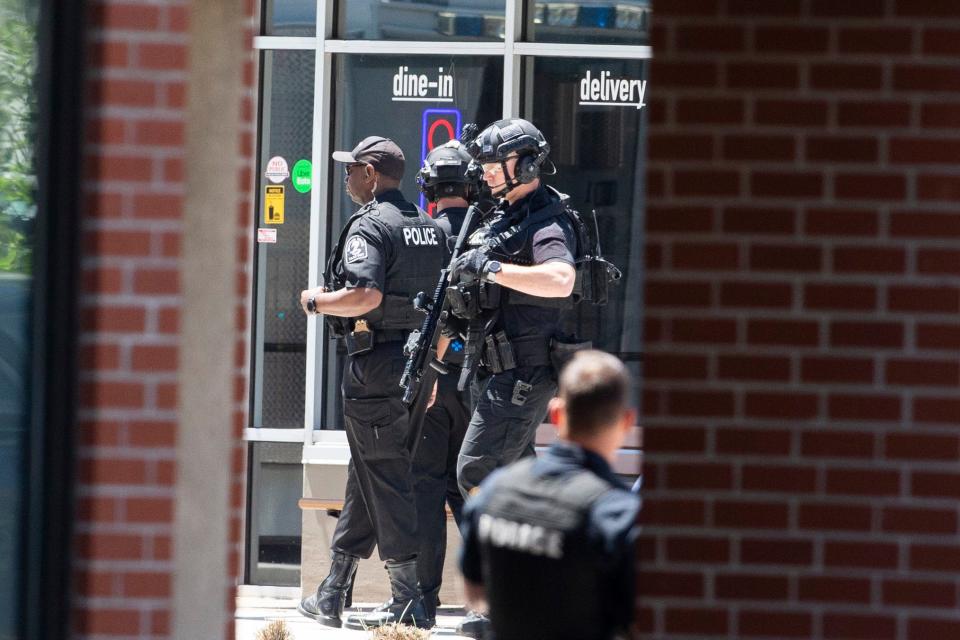 Memphis Police Department officers respond to a “potential armed party” at Ubee’s on Highland Street near the University of Memphis in Memphis, Tenn., on May 2, 2023. FOX13 News’ station, which is next to Ubee’s, reported that a bullet “fell outside the front door of the lobby,” when a shot was fired at the station.