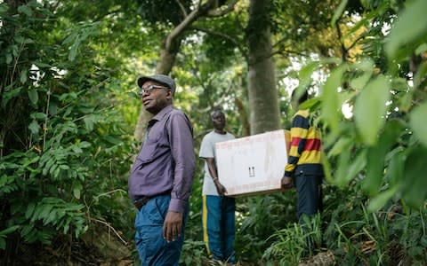 A treatment kit for one person is transported into a remote community in Bandundu. The oral medication will render this largely unnecessary  - Credit: Xavier Vahed/DNDi