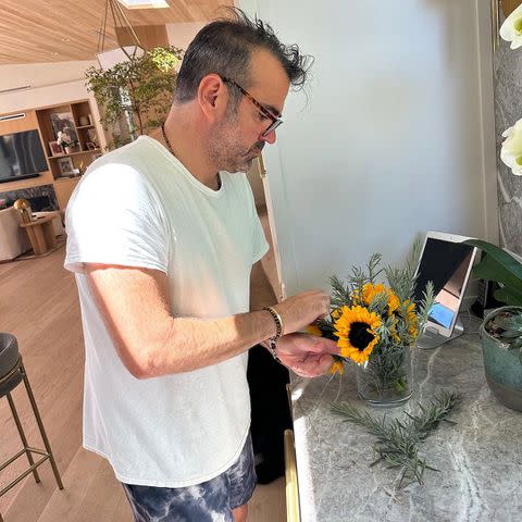 <p>giadadelaurentiis/Instagram</p> Shane Farley arranges flowers.