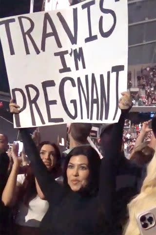 <p>Kourtney Kardashian/Instagram</p> Kourtney Kardashian reveals she's expecting a child with Travis Barker at Blink-182 concert.