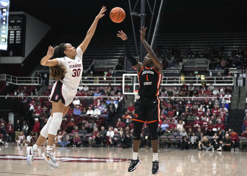 Oregon State guard Bendu Yeaney (1) has a shot blocked by Stanford guard Haley Jones (30) during the second half of an NCAA college basketball game Friday, Jan. 27, 2023, in Stanford, Calif. Stanford won 63-60. (AP Photo/Tony Avelar)