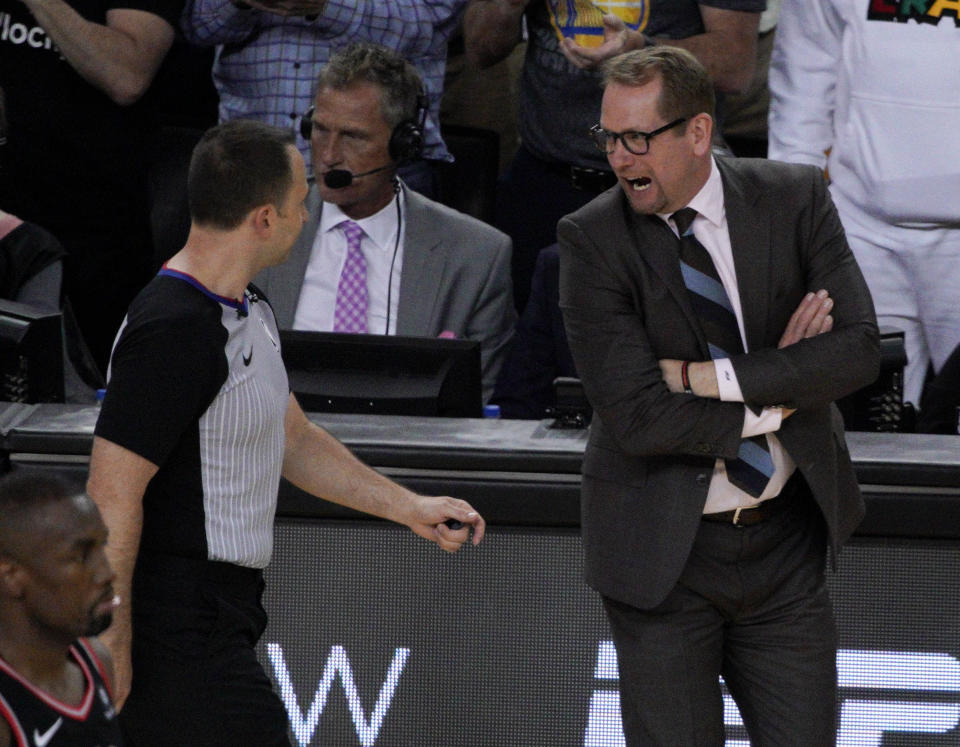 Toronto Raptors head coach Nick Nurse talks with an official during the first half of Game 3 of basketball's NBA Finals between the Golden State Warriors and the Raptors in Oakland, Calif., Wednesday, June 5, 2019. (AP Photo/Tony Avelar)