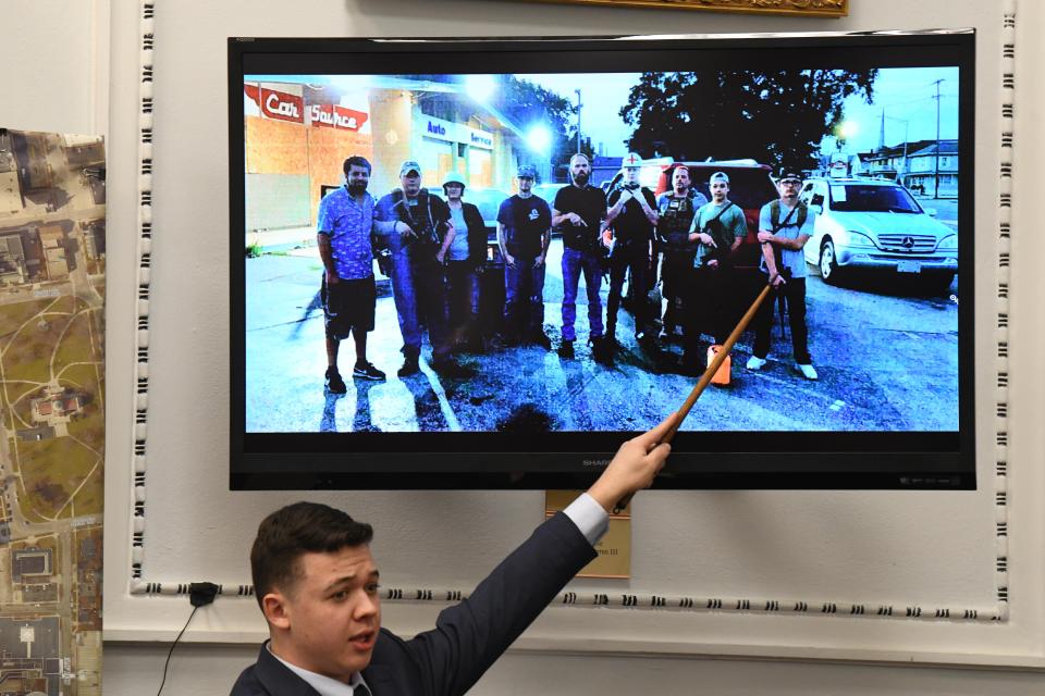 Kyle Rittenhouse points at an image on a screen at his trial at the Kenosha County Courthouse on Nov. 10. 