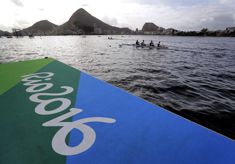 Athletes warm up during rowing team practices