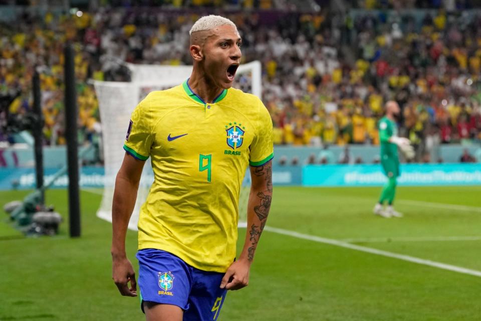 Brazil's Richarlison celebrates after scoring the opening goal during the World Cup group G football match between Brazil and Serbia, at the Lusail Stadium in Lusail, Qatar, Thursday, Nov. 24, 2022. (AP Photo/Andre Penner)