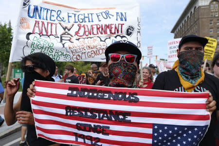 Demonstrators join in a march by various groups, including "Black Lives Matter" and "Shut Down Trump and the RNC". REUTERS/Lucas Jackson