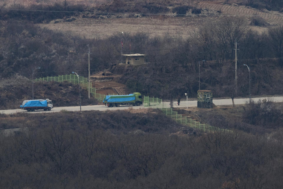 South Korean trucks carrying tons of insecticide pass the North Korea's guard post near the industrial complex in Kaesong, observed from the Dora Observation Post, in Paju, South Korea, Thursday, Nov. 29, 2018. South Korea has sent about 50 tons of insecticide to North Korea to help stop a pine tree disease from spreading. (Im Byung-sik/Yonhap via AP)