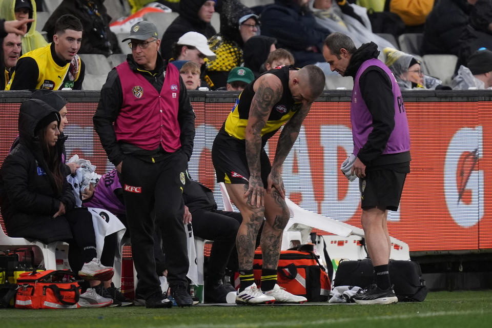 MELBOURNE, AUSTRALIA - JUNE 30: Dustin Martin of the Tigers receives medical attention on his back during the round 16 AFL match between Richmond Tigers and Carlton Blues at Melbourne Cricket Ground, on June 30, 2024, in Melbourne, Australia. (Photo by Daniel Pockett/Getty Images)