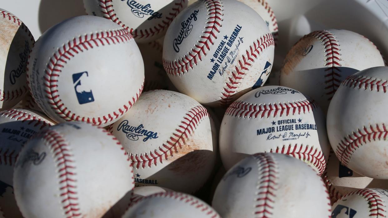 Representative: In this 14 February 2020, file photo, baseballs sit in a bucket after they were used for fielding practice during spring training baseball workouts for pitchers and catchers at Cleveland Indians camp in Avondale, Arizona (AP)