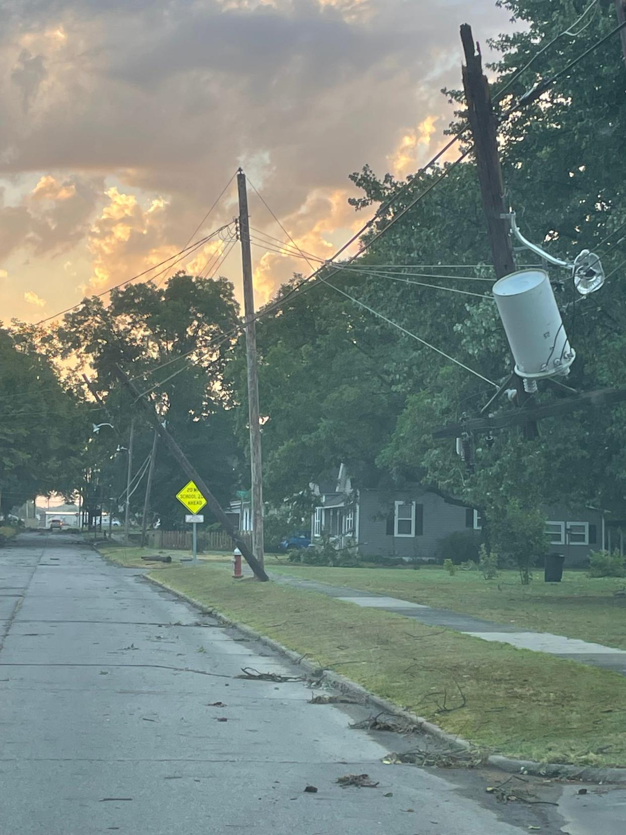 Power poles toppled in a storm late Sunday, July 17, 2022 in Paris, Arkansas.