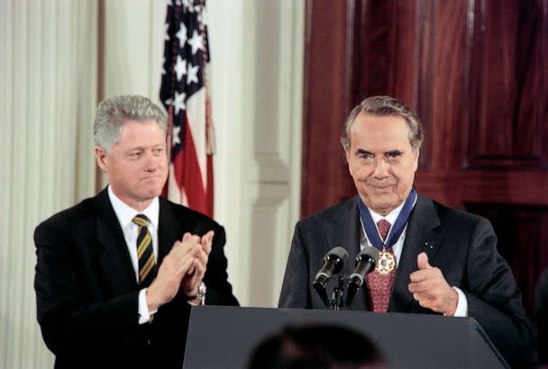 PHOTO: Former Senator Bob Dole reacts after receiving the Presidential Medal of Freedom in ceremonies at the White House, Jan. 17, 1997. (Joyce Naltchayan/AFP via Getty Images, FILE)