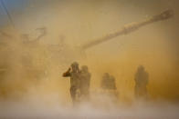 An Israeli artillery unit fires toward targets in Gaza Strip, at the Israeli Gaza border, Wednesday, May 12, 2021. (AP Photo/Yonatan Sindel)