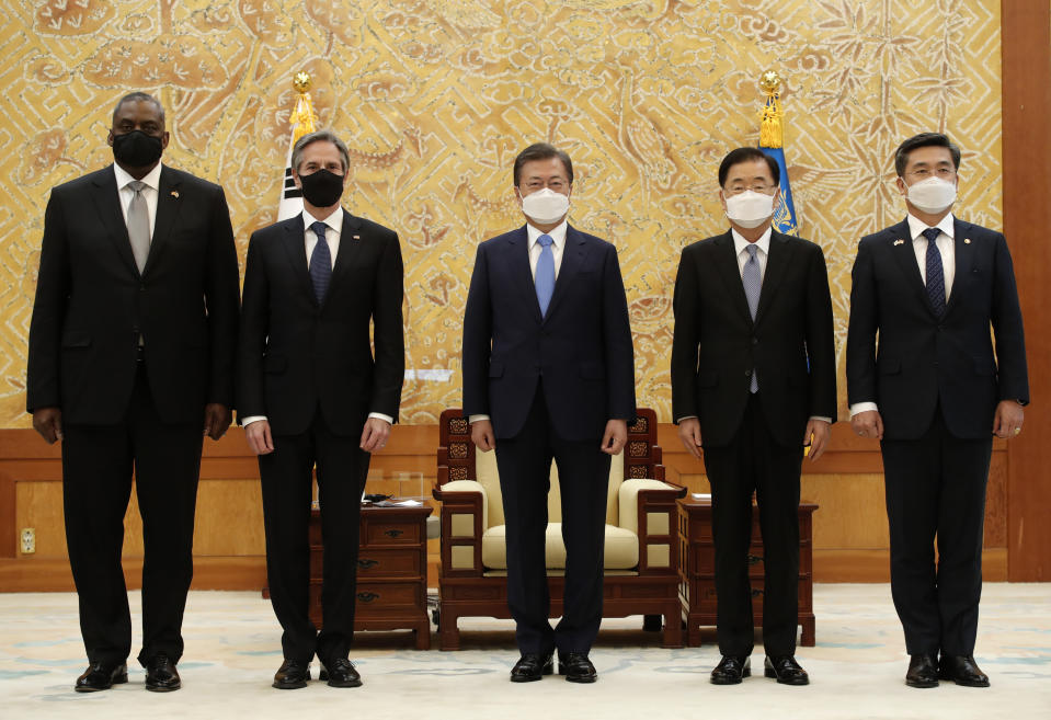 South Korean President Moon Jae-in, center, stands for the media with U.S. Secretary of State Antony Blinken, second from left, U.S. Defense Secretary Lloyd Austin, left, South Korean Foreign Minister Chung Eui-yong, second from right, and South Korean Defense Minister Suh Wook before their meeting at the presidential Blue House in Seoul, South Korea, Thursday, March 18, 2021. (AP Photo/Lee Jin-man, Pool)
