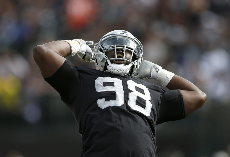 Oakland Raiders defensive tackle Frostee Rucker (98) celebrates during the second half of an NFL football game against the Cleveland Browns in Oakland, Calif., Sunday, Sept. 30, 2018. (AP Photo/D. Ross Cameron)