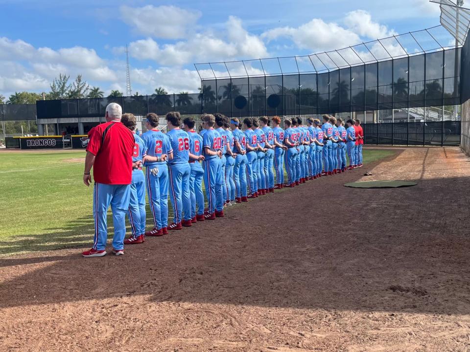 Alabama 7A state champion Vestavia Hills baseball lines up before first pitch at Palm Beach Central on Tuesday, March 5.