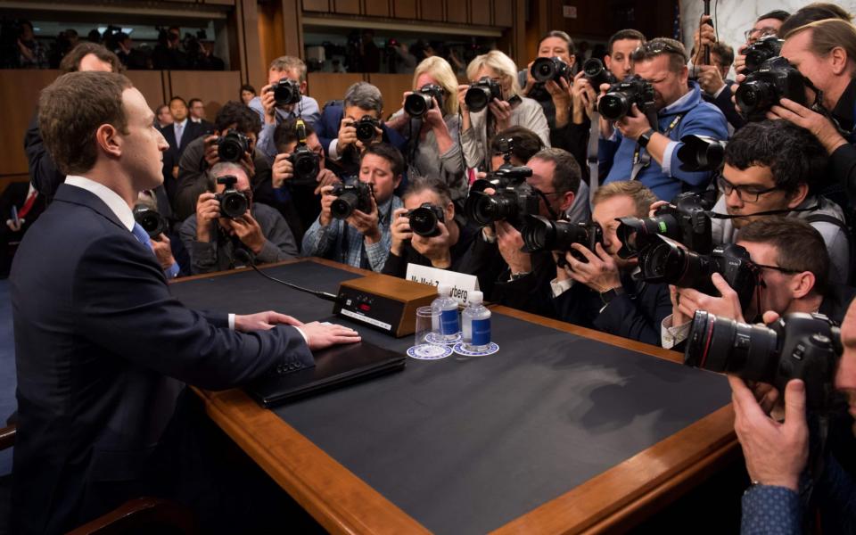 Facebook CEO Mark Zuckerberg sat on a so-called 'booster seat' during his Congress grilling - AFP