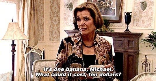 Jessica Walter as Lucille Bluth says, "It's one banana, Michael. What could it cost, ten dollars?" while holding a banana in a luxurious living room