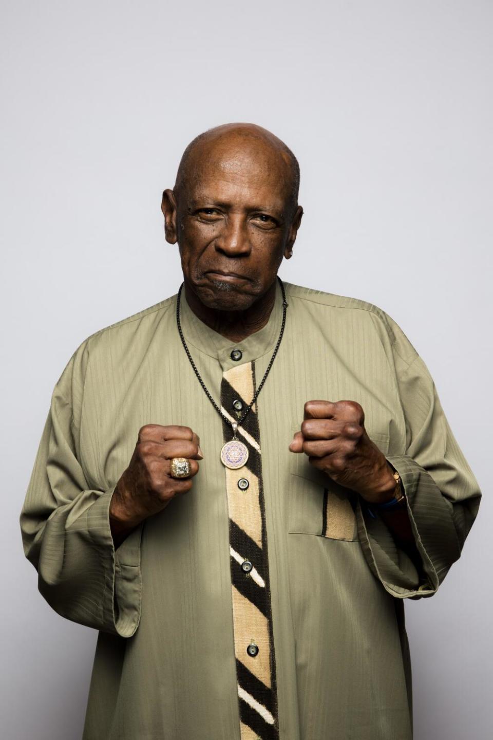 Louis Gossett Jr. wearing a medallion