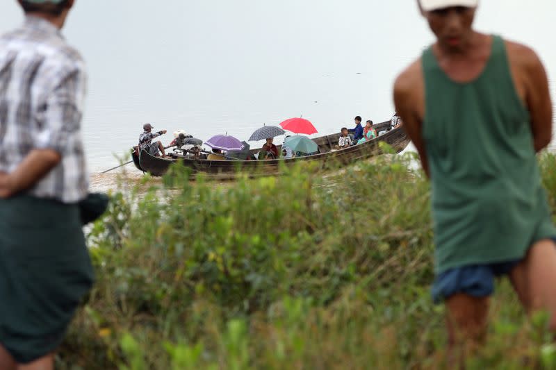 Residents of nearby village cross Hintha Kyun island in Mawlamyine