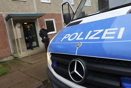 German police are seen outside a building, that also serves as an accommodation facility for refugees, in the village of Suhl, Germany, October 25, 2016. REUTERS/Kai Pfaffenbach