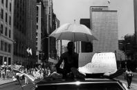 <p>Two boys riding on the roof of a car in the Fourth of July Parade, hold a sign that reads: “Our generation is drug free,” on Michigan Avenue near Adams Street, Chicago, Ill., 1988. (Photo: David Dapogny/Chicago History Museum/Getty Images) </p>