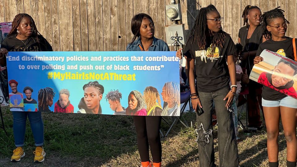 Supporters of Darryl George hold signs during a protest outside of the home of Barbers Hill Independent School District superintendent Greg Poole on Wednesday, February, 22, 2024. - Juan Lozano/AP