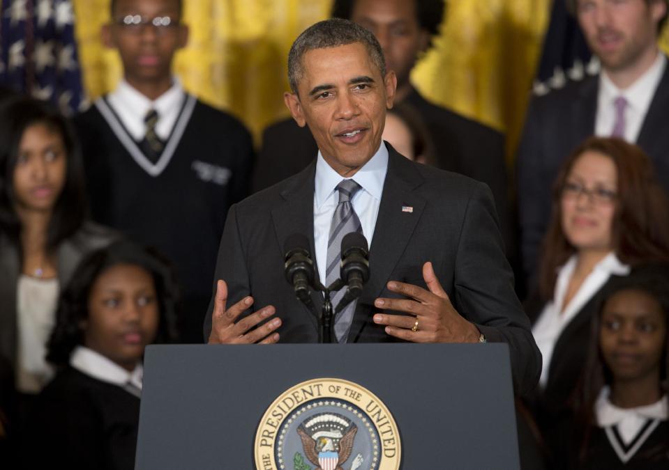 President Barack Obama speaks about his Promise Zones Initiative, Thursday, Jan. 9, 2014, in the East Room of the White House in Washington. Also on stage are representatives and community members from each of the five Zones. The Promise Zone Initiative is part of a plan to create a better bargain for the middle-class by partnering with local communities and businesses to create jobs, increase economic security, expand educational opportunities, increase access to quality, affordable housing and improve public safety. (AP Photo/Carolyn Kaster