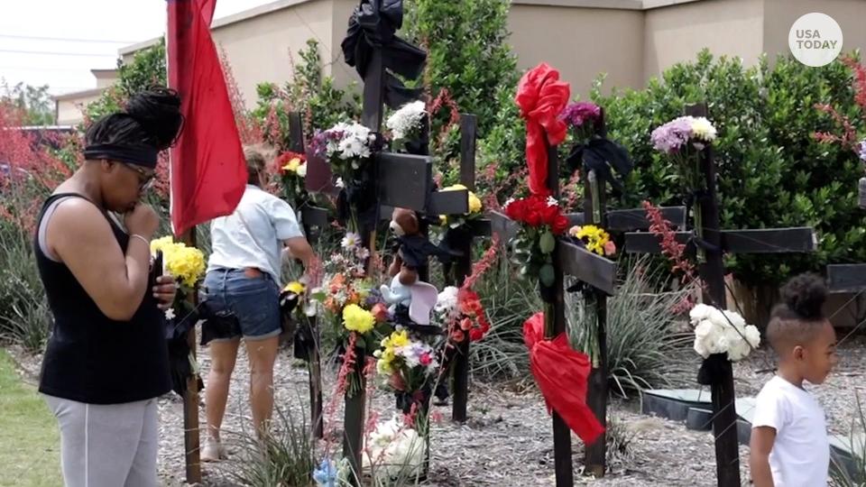 A memorial was set up outside the Allen Premium Outlets mall in Texas, on Sunday, May 7, honoring the eight people killed by a gunman who opened fire on Saturday.