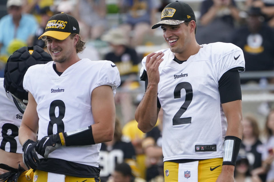 Pittsburgh Steelers quarterback Mason Rudolph (2) stands with Kenny Pickett (8) during practice at NFL football training camp in the Latrobe Memorial Stadium in Latrobe, Pa., Monday, Aug. 8, 2022. (AP Photo/Keith Srakocic)