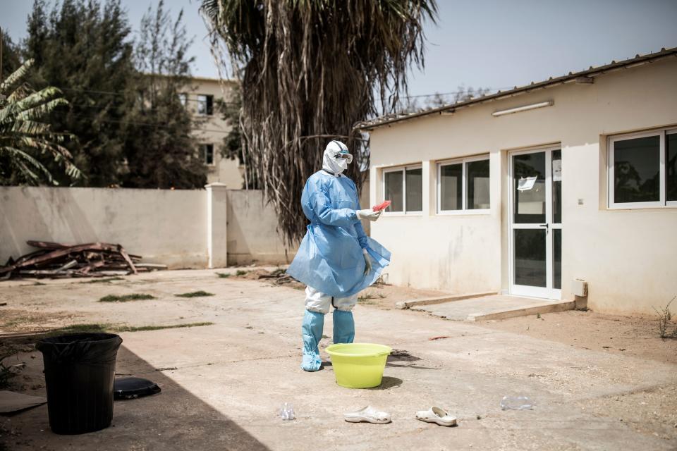 A Health worker holds swabs tests from patients inside a COVID-19 coronavirus ward that houses suspected cases in Pikine Hospital in Dakar. Source: AFP