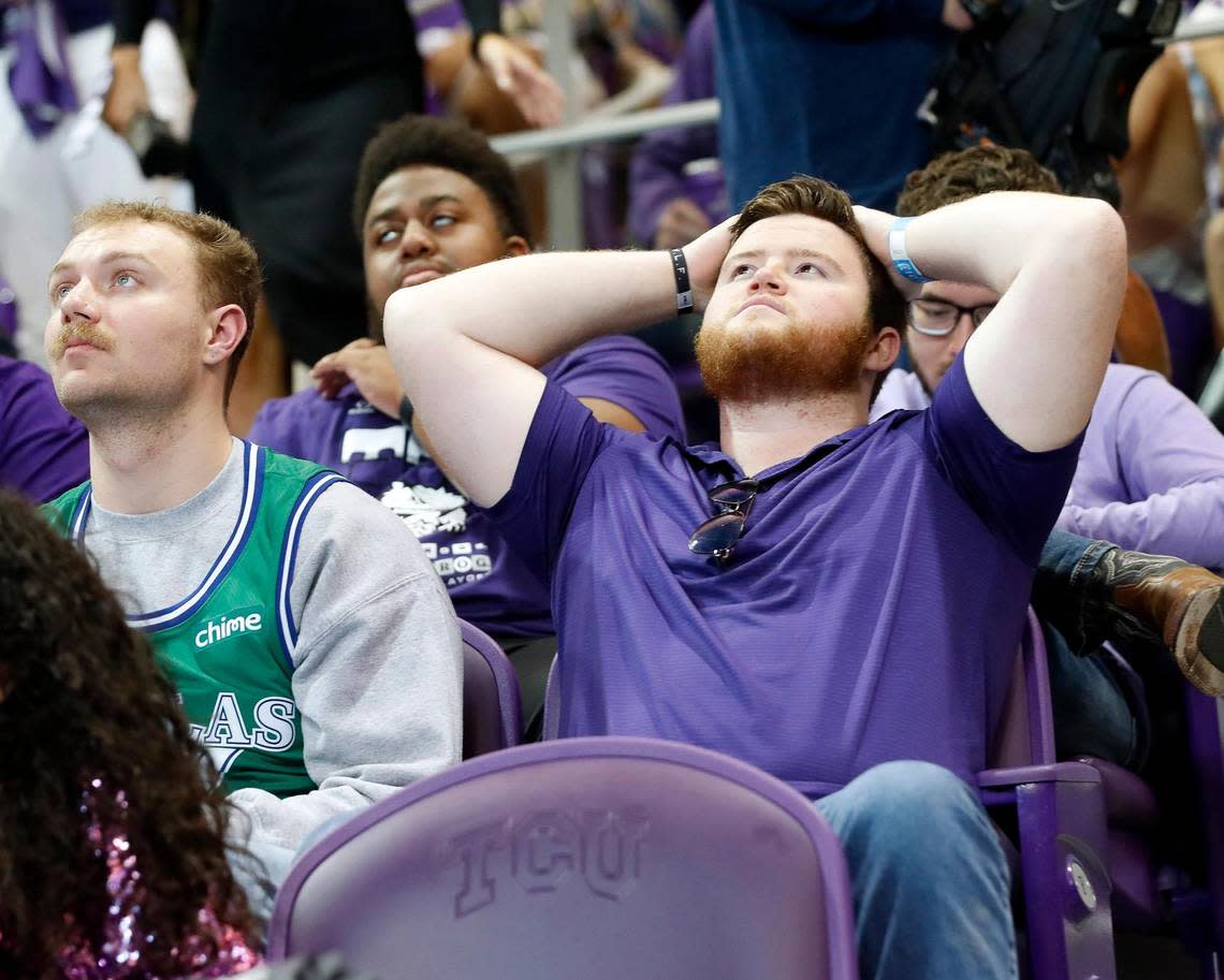 A Horned Frog fan reacts after Max Duggan threw his second interception during the CFP national championship football game watch party at Schollmeier Arena, in Fort Worth, Texas, Monday, Jan. 9, 2023.