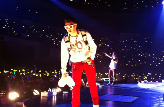 BigBang member T.O.P. tosses his towel, sending fans scrambling to retrieve it during the BigBang Alive Galaxy Tour in Manila on Oct. 24 at the Mall of Asia Arena. (Photo by Erikson Tan)