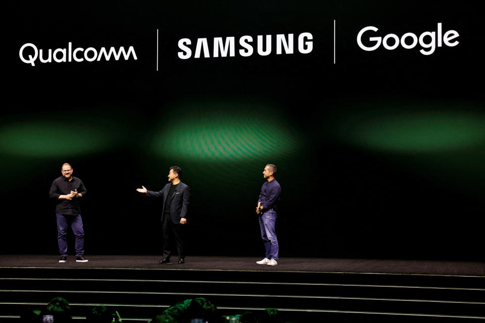 TM Roh, President and Head of Mobile eXperience Business at Samsung Electronics, Cristiano Amon, President & CEO Qualcomm Incorporated, and Hiroshi Lockheimer, SVP, Platforms & Ecosystems at Google, stand on stage as Samsung Electronics unveils its latest flagship smartphones in San Francisco, California, U.S. February 1, 2023. REUTERS/Peter DaSilva REFILE - CORRECTING ID