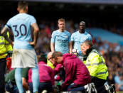 <p>Manchester City’s Ederson Moraes receives medical attention as Kevin De Bruyne and Benjamin Mendy look on A </p>