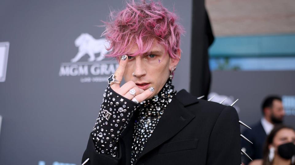 LAS VEGAS, NV - May 15: 2022 BILLBOARD MUSIC AWARDS -- Pictured: Machine Gun Kelly arrives at the 2022 Billboard Music Awards held at MGM Grand Garden Arena on May 15, 2022. -- (Photo by Christopher Polk/NBC/NBCU Bank photos via Getty Images)