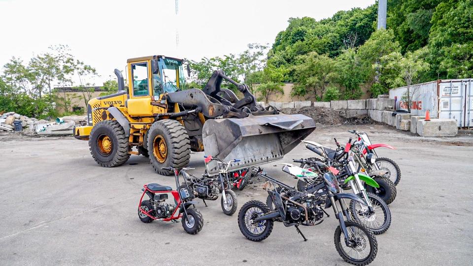 Dirt bikes lined up like food for a front-loader at Thursday's news conference announcing progress against street-illegal vehicles running rampant on the streets of Providence. Since launching a crackdown on dirt bikes and all-terrain vehicles last month, Mayor Brett Smiley said, the city has rounded up 63 vehicles and made 24 arrests – compared with the 102 vehicles seized during former Mayor Jorge Elorza's time in office, from 2020 through 2022.