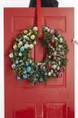 <p>A faux wreath provides the basis for this sweet decoration. Group ornaments by color, placing warm shades (pink, red, orange, yellow and gold) on one side and cool tones (blue, purple, green and silver) on the other. </p><p><a class="link " href="https://www.amazon.com/AMS-Christmas-Ornaments-Decorations-Shatterproof/dp/B095RJ13X8/?tag=syn-yahoo-20&ascsubtag=%5Bartid%7C10067.g.42146682%5Bsrc%7Cyahoo-us" rel="nofollow noopener" target="_blank" data-ylk="slk:Shop Now;elm:context_link;itc:0">Shop Now</a></p>