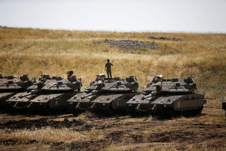 <p>Israeli soldiers stand on tanks in the Israeli-occupied Golan Heights, Israel, May 10, 2018. (Photo: Ronen Zvulun/Reuters) </p>