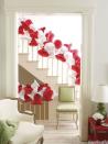 <p>Banisters can be tricky to decorate. For a light, airy, and cheerful look, try <a href="https://www.housebeautiful.com/room-decorating/colors/tips/g492/red-and-green-christmas-decorations/" rel="nofollow noopener" target="_blank" data-ylk="slk:stringing red and white paper bells;elm:context_link;itc:0;sec:content-canvas" class="link ">stringing red and white paper bells</a> together with fishing line.<br></p>