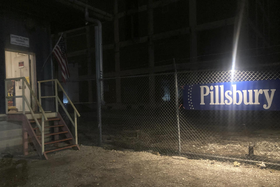 The entrance to the former Pillsbury Mills in Springfield, Ill., is spruced up for the "Visitors Art Exhibit," Nov. 9, 2023. While waiting for government funding and approval to demolish the former Pillsbury Mills in Springfield, the nonprofit group Moving Pillsbury Forward sponsored exhibitions in which artists caught painting graffiti at the site were invited to stage exhibitions of their work at the plant. (AP Photo/John O'Connor)