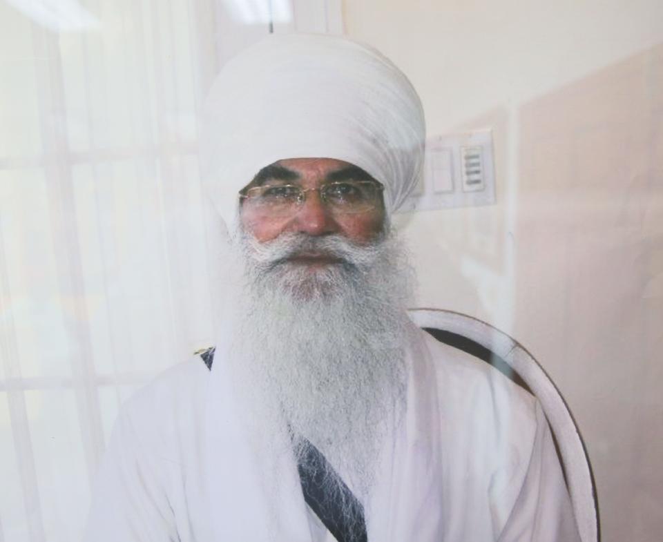 A photograph of Punjab Singh hangs on the wall at the Sikh Temple of Wisconsin in Oak Creek.