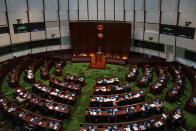 Lawmakers attend the second reading of the Basic Law Article 23 legislation at the Legislative Council in Hong Kong, Tuesday, March 19, 2024. (AP Photo/Louise Delmotte)