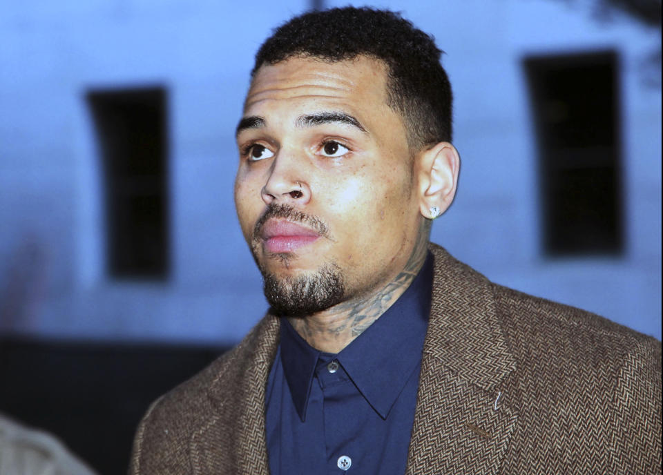 FILE - In this Feb. 3, 2014 file photo, R&B singer Chris Brown arrives at a Los Angeles Superior Court for a probation review hearing in Los Angeles. Brown admitted he violated his probation for his 2009 attack on Rihanna during a court hearing on Friday, May 9, 2014, and was sentenced to serve an additional 131 days in jail, community labor and remain on probation until January 2015. (AP Photo/Nick Ut, file)