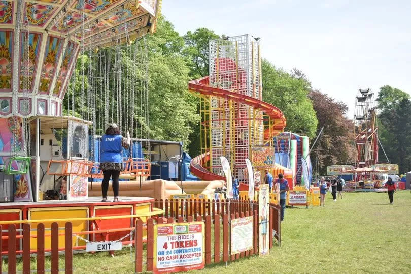 Selection of funfair rides including slide, helter skelter, and Ferris wheel