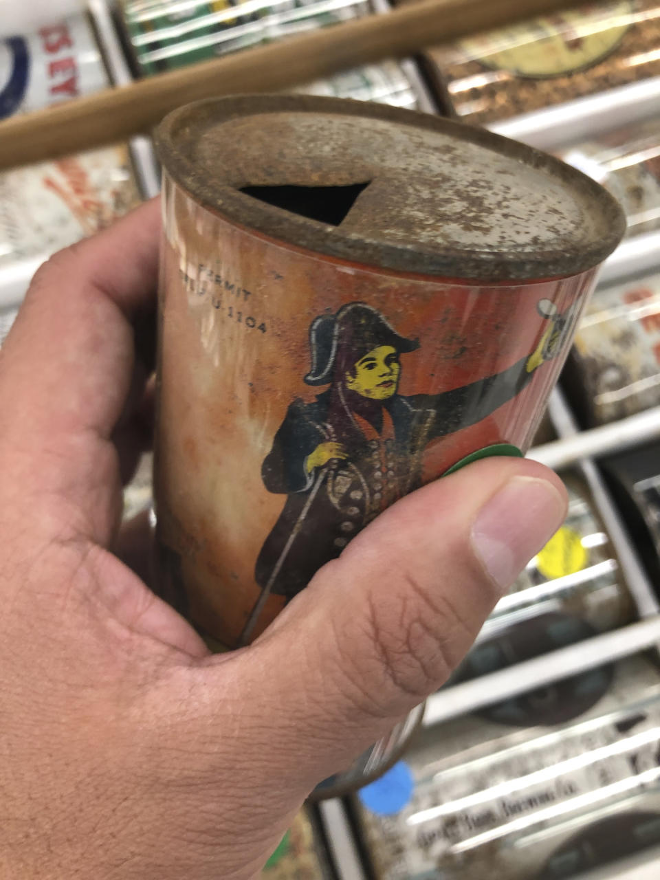 A 1930s-era beer can is held on Thursday, Aug. 29, 2019, in Albuquerque, N.M., at the 49th annual gathering of members of the Brewery Collectibles Club of America. Collectors from around the world began Thursday buying, trading and selling containers of brews at the annual four-day event billed the "CANvention." (AP Photo/Russell Contreras)